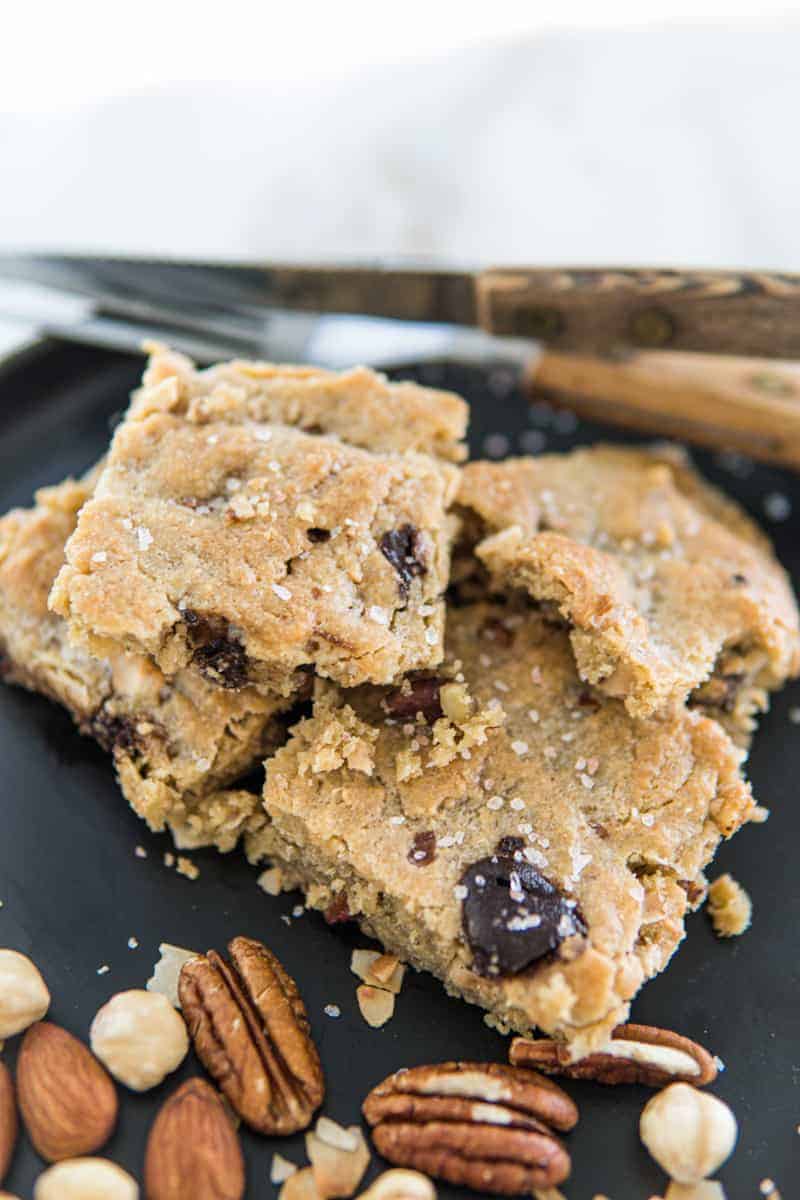 This Keto Tahini Chocolate Chip Nut Cookie Bars are made with tahini, eggs, nuts and sugar-free chocolate, erythritol, baking powder and liquid stevia.