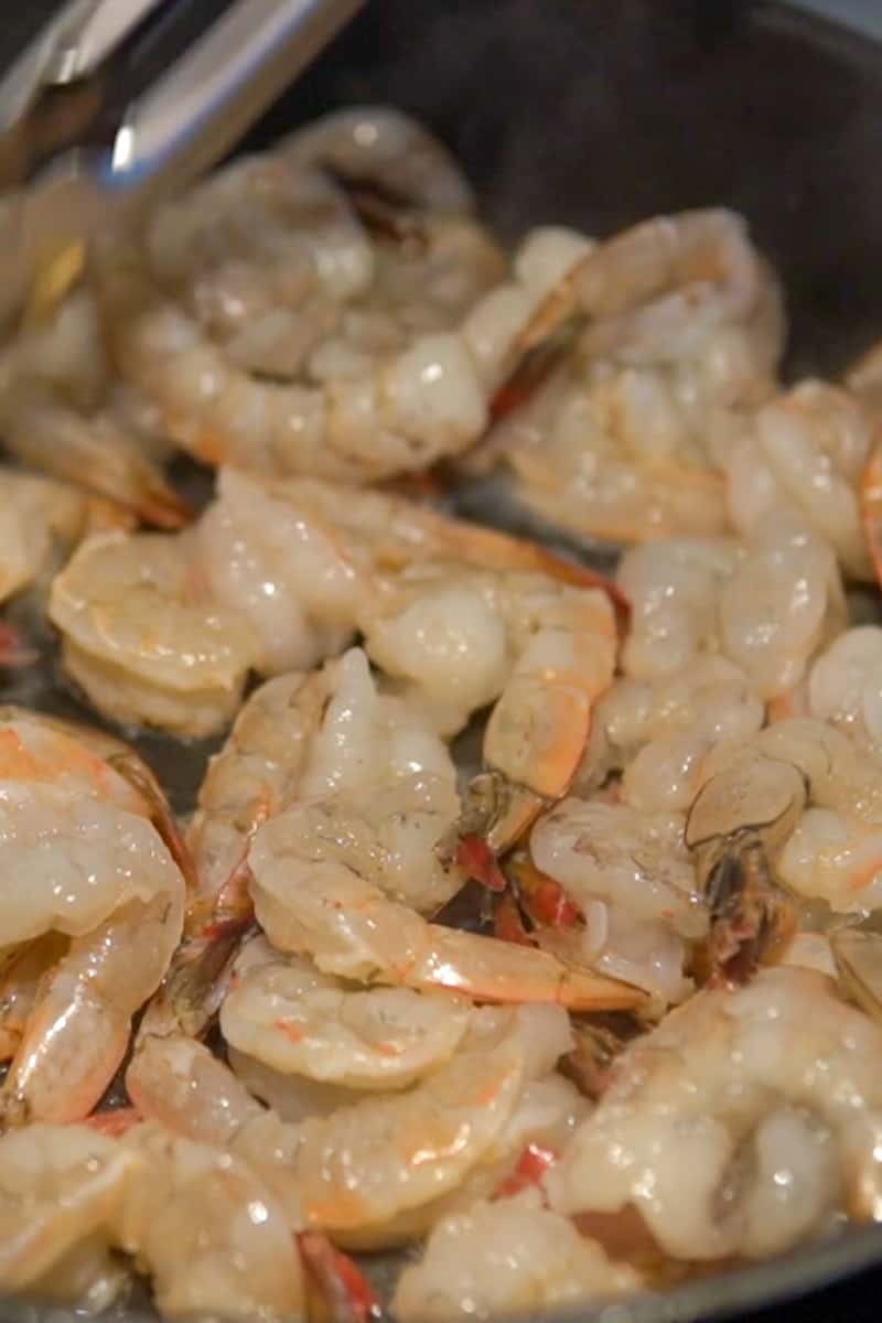 Heat up a large nonstick skillet and pour in the whisked sauce. On medium-high heat, bring to a simmer. Add the shrimp into the simmer sauce and cook on both sides, 2 to 3 minutes per side.