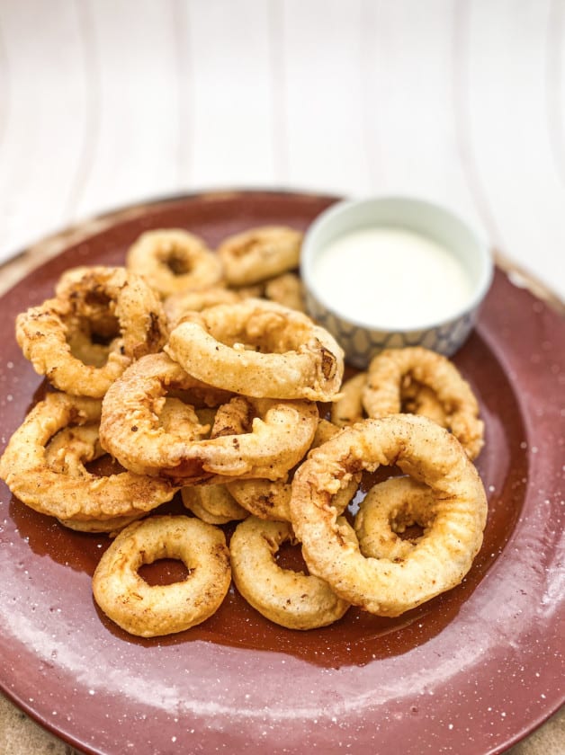This Italian Fried Calamari is made with buttermilk, flour, paprika, chili powder and fried to perfection.