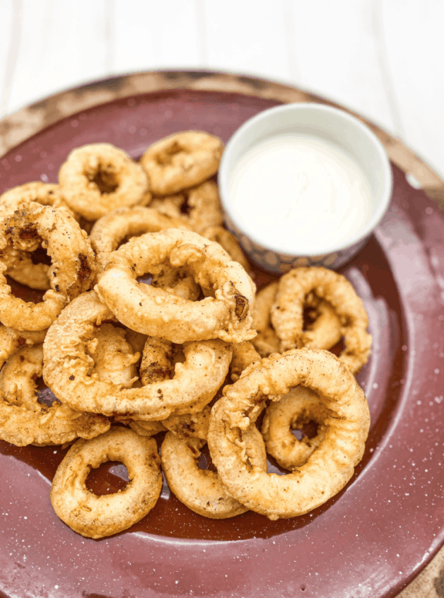 This Italian Fried Calamari is made with buttermilk, flour, paprika, chili powder and fried to perfection.