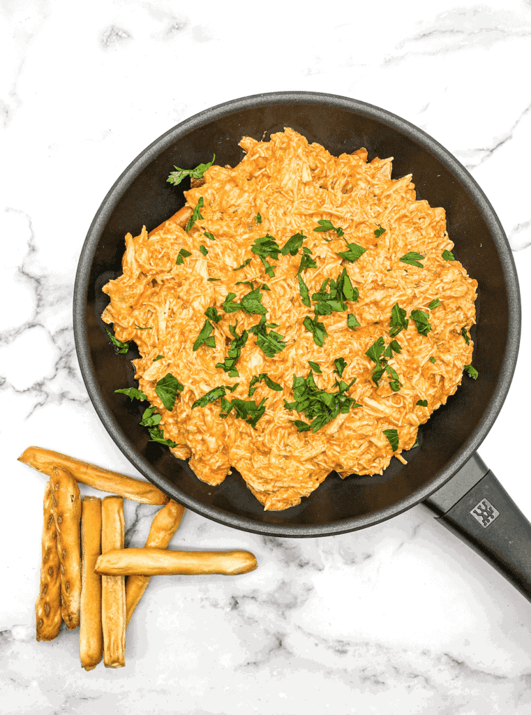This Buffalo Chicken Pretzel Skillet is made with chicken, ranch, parsley and homemade buffalo sauce