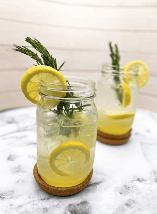 This Spiked Lemonade is made with fresh lemon juice, sugar, vodka, seltzer water, and garnished with rosemary sprigs. 