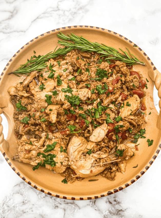 This Chicken and Sausage with Porcini Mushrooms is made with a whole chicken, sausage, porcini mushrooms, tomatoes, and simmered for 2 hours. 