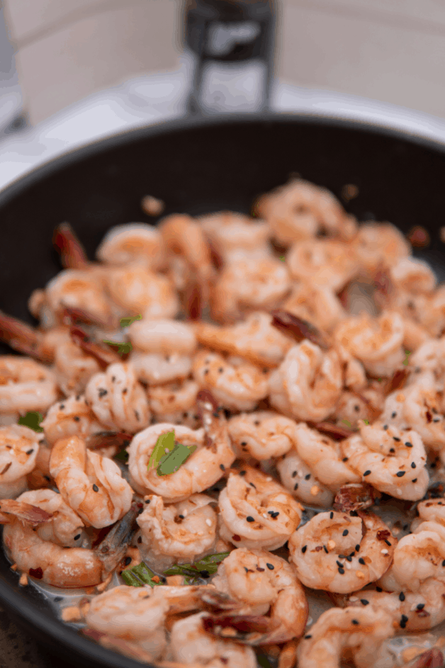 This Healthy Sweet and Sour Shrimp has peanuts, scallions and lime juice, red pepper flakes, fish sauce, rice vinegar and sugar.