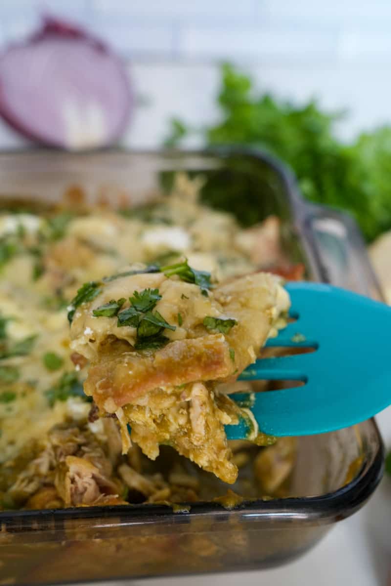 This Pastel Azteca Recipe is made with tortillas, salsa verde, carnitas, mozzarella and sour cream and assembled similarly to a lasagna.