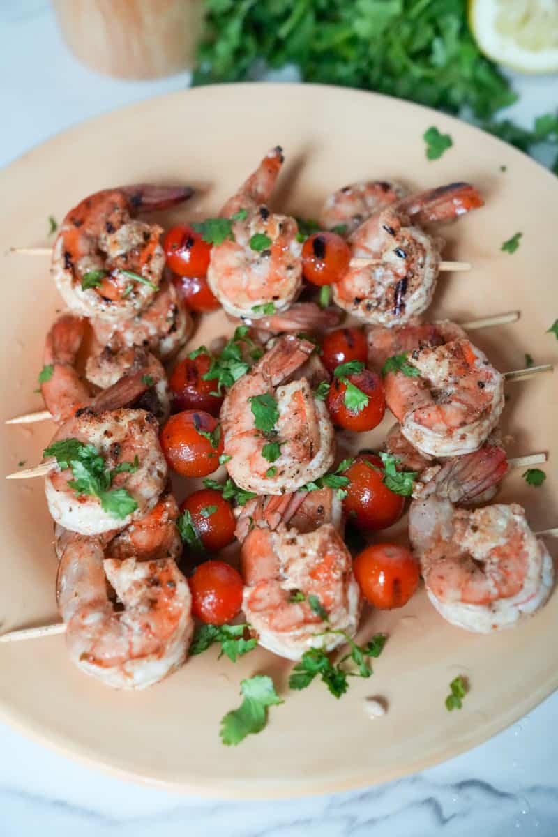 These Shrimp Skewers with Veggies Recipe is made using large shrimp, cherry tomatoes and doused in a delicious olive oil marinade. 