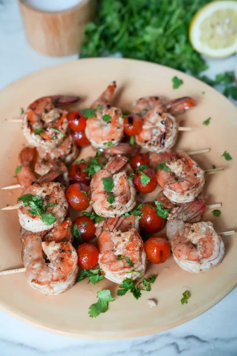These Shrimp Skewers with Veggies Recipe is made using large shrimp, cherry tomatoes and doused in a delicious olive oil marinade. 