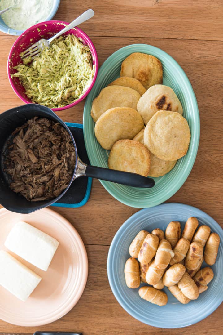 This Arepas Recipe (Venezuelan and Colombian) is made with white corn meal, water and salt, what changes their origin is the filling. 