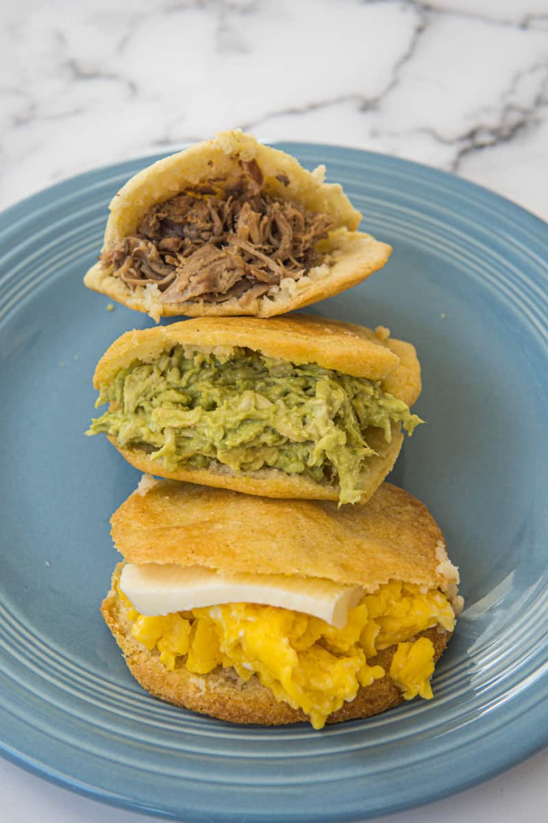These Arepas Colombianas are made with just three ingredients: white corn meal, water and salt. They can be filled with anything your heart desires!