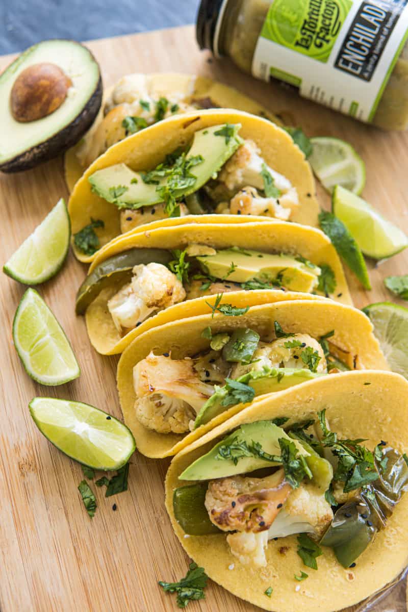 This Cauliflower Tacos Recipe are made with cauliflower, peppers, onion, soy sauce, sesame seeds, served on tortillas and garnished with cilantro and avocado slices.