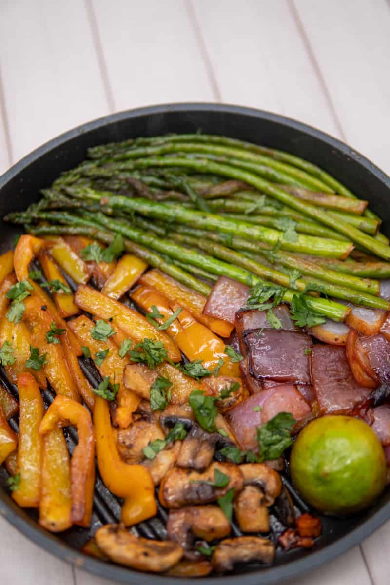 This Grilled Vegetables Recipe can be a combination of asparagus, mushrooms bell peppers and red onion, garnished with chopped cilantro.