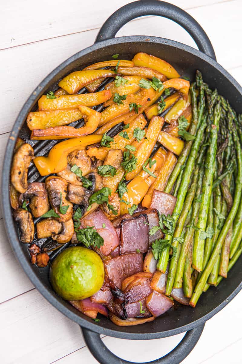 This Grilled Vegetables Recipe can be a combination of asparagus, mushrooms bell peppers and red onion, garnished with chopped cilantro.