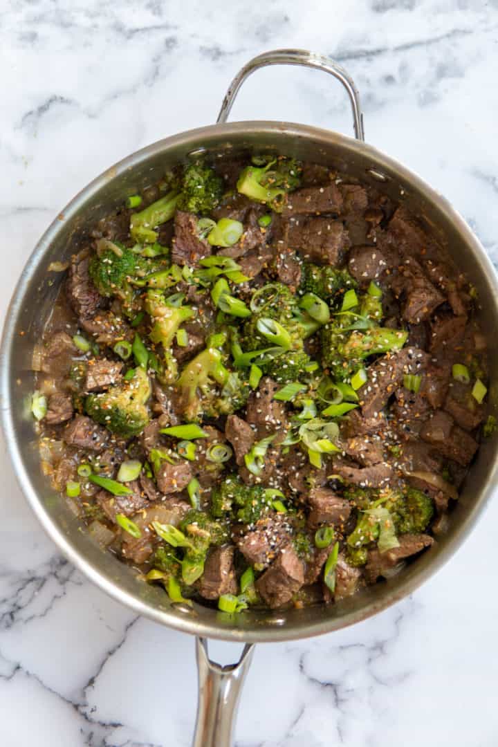 This beef and broccoli keto dish is made with flank steak, broccoli, onions, xanthan gum, erythritol, garlic, ginger, and soy sauce.