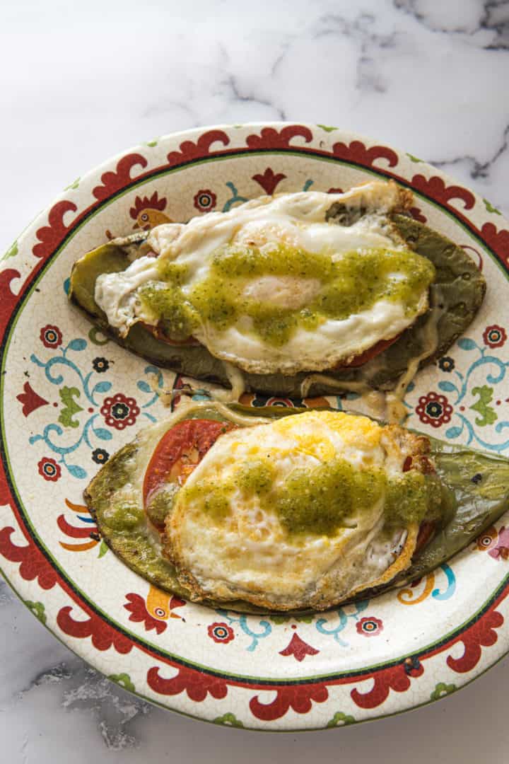 This Nopales and Eggs Recipe is made with oil, cactus paddles, tomatoes, salsa verde, and eggs anyway you want them.