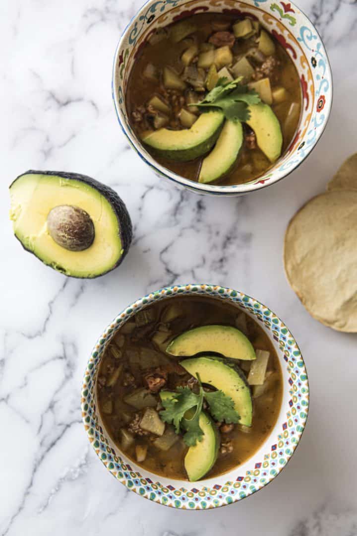 This Zucchini Beef Soup Recipe is made with onion, carrots, zucchini, spanish chorizo, ground beef, tomato, and cilantro.