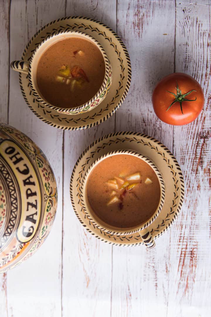 This Vegan Gazpacho is made with tomatoes, cucumber, garlic, onion, bell pepper, olive oil, salt and blended to perfection. 