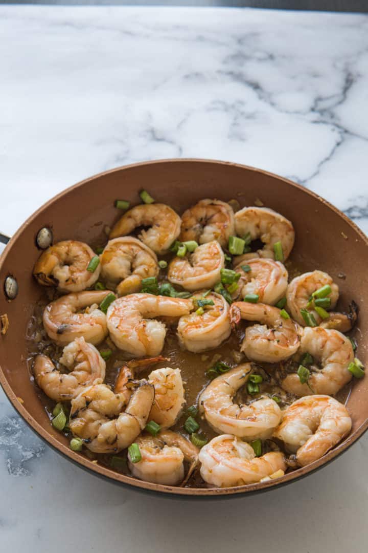 This Gambas al Ajillo (Spanish Garlic Shrimp) is made with shrimp, ten cloves of garlic, olive oil, and garnished with chopped scallions.  
