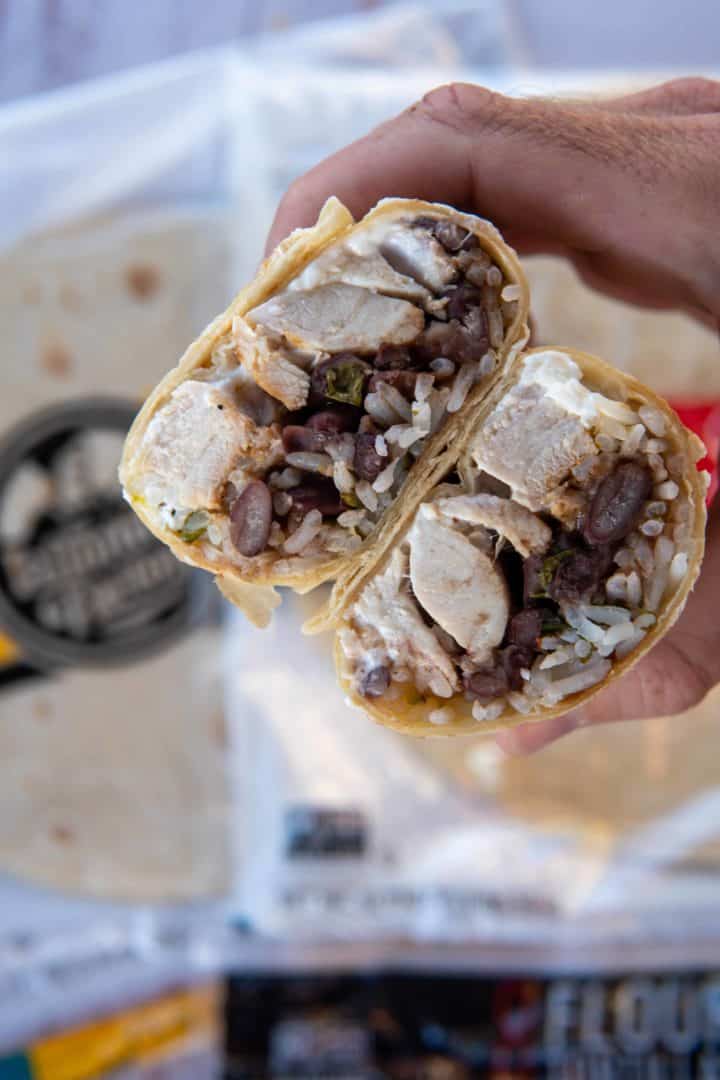 This Chipotle Copycat Chicken Burrito is made with chicken thighs, flour tortillas, black beans, cilantro rice, guacamole, romaine, cheese and sour cream.