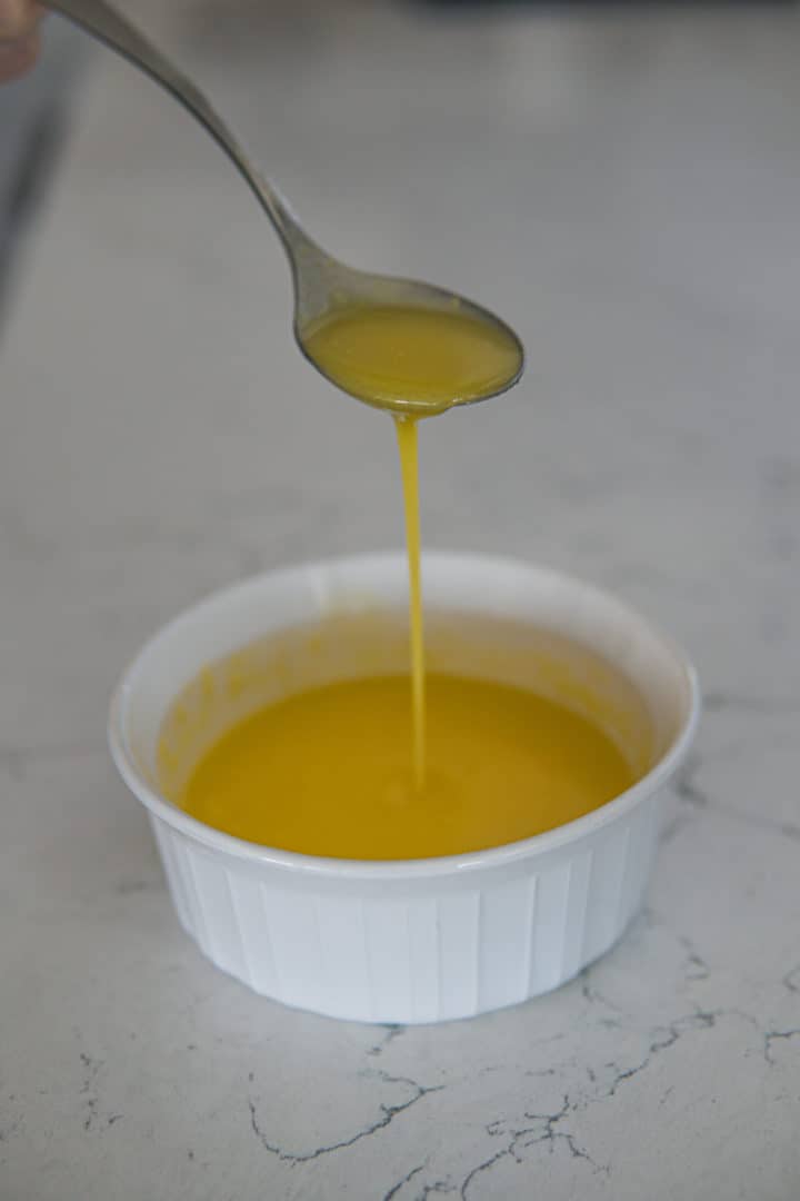 This hollandaise sauce keto recipe is made with three ingredients: room temperature egg yolks, melted salted butter, and lemon juice.