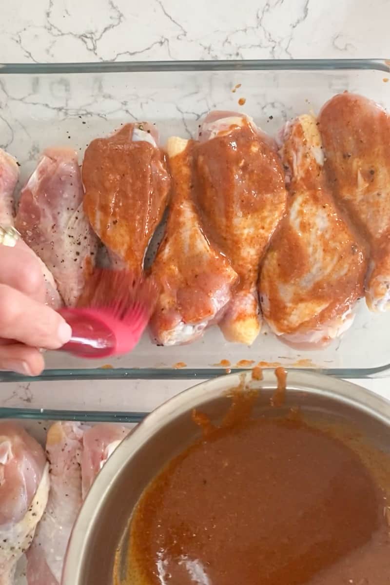Pour the sauce evenly over the chicken drumsticks and toss gently to coat well. You may also use a basting brush to brush the sauce evenly on the chicken.