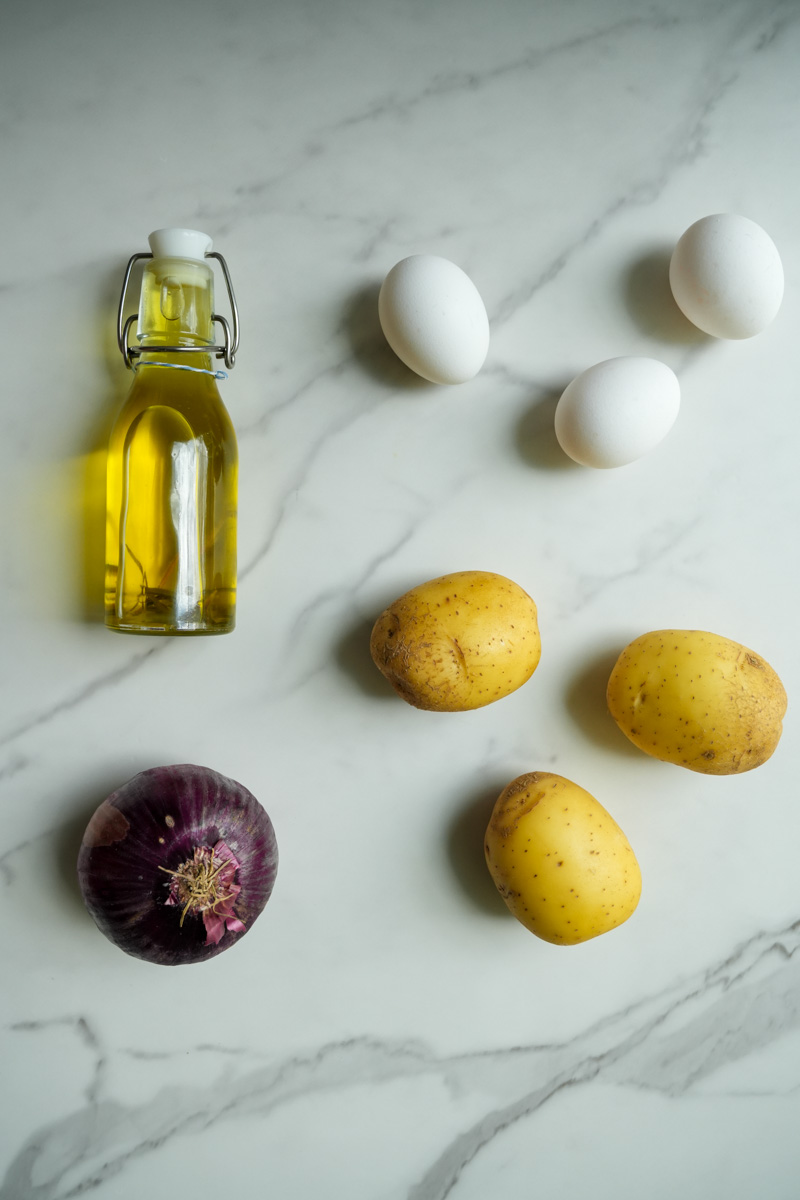 This is a Spanish Tortilla Recipe (Tortilla De Patatas) recipe made with gold potatoes, yellow onion, eggs, and lots of olive oil.