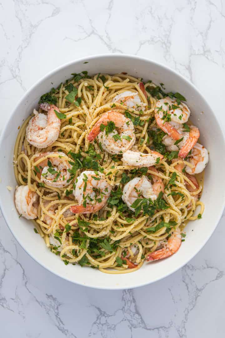 This Shrimp scampi without wine is made with shrimp, butter, broth, lemon juice, olive oil, red pepper flakes, parmesan and parsley.