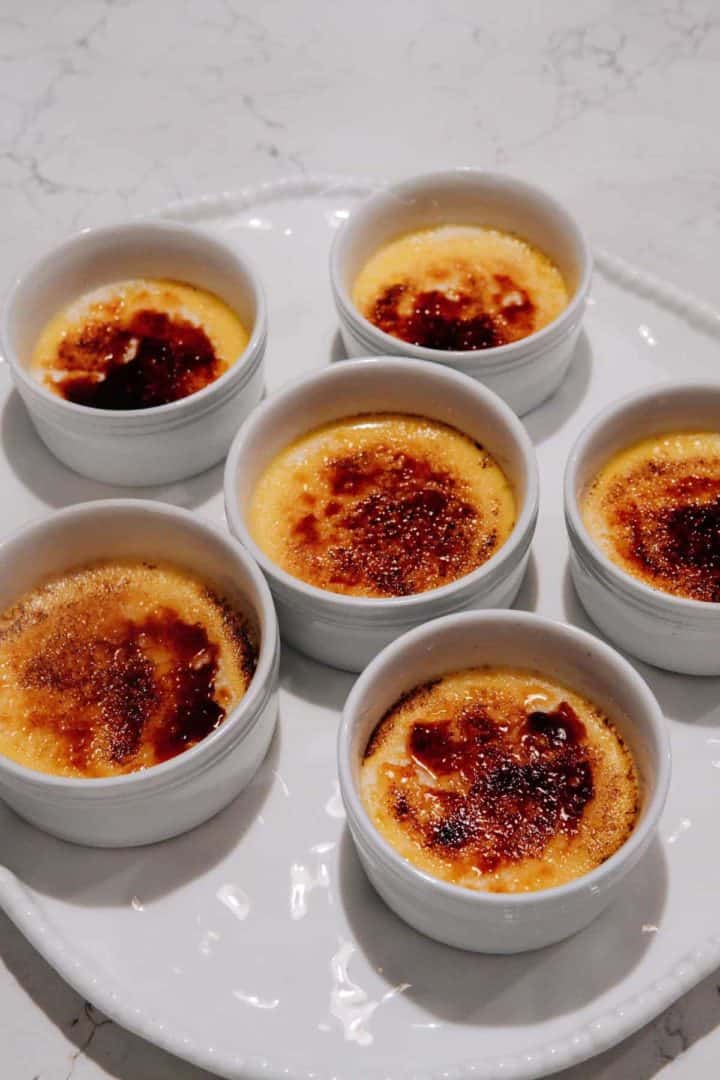 This Crème Brûlée is made with eggs, sugar, heavy cream, vanilla extract, Grand Marnier and baked in ramekins and torched.