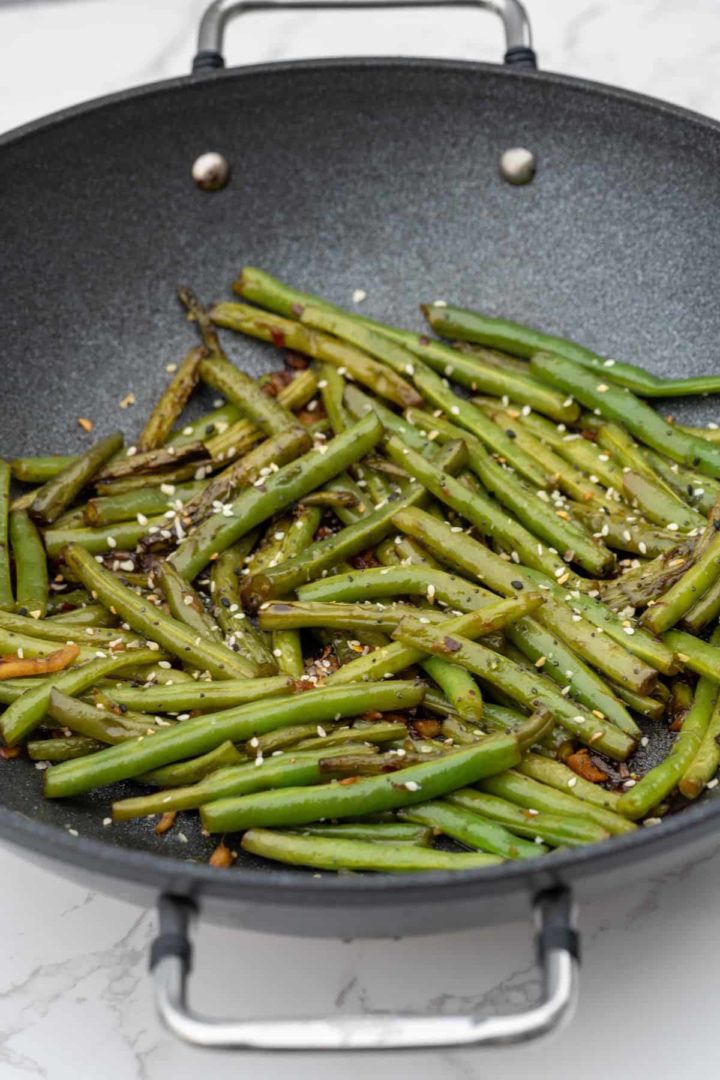 These Chinese Green Beans Recipe are made with trimmed green beans, ginger, garlic, soy sauce, rice vinegar, and sugar.