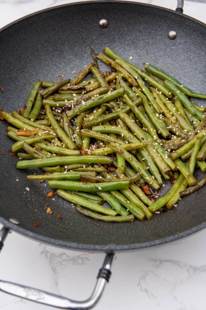 Garnish with sesame seeds. Enjoy this Szechuan Green Beans Recipe. 