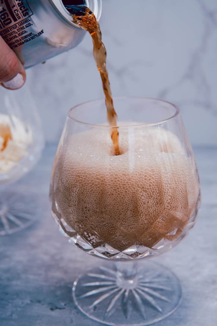 This A&W Root Beer Float is made with vanilla ice cream, root beer, whipped cream and fresh or maraschino cherries.