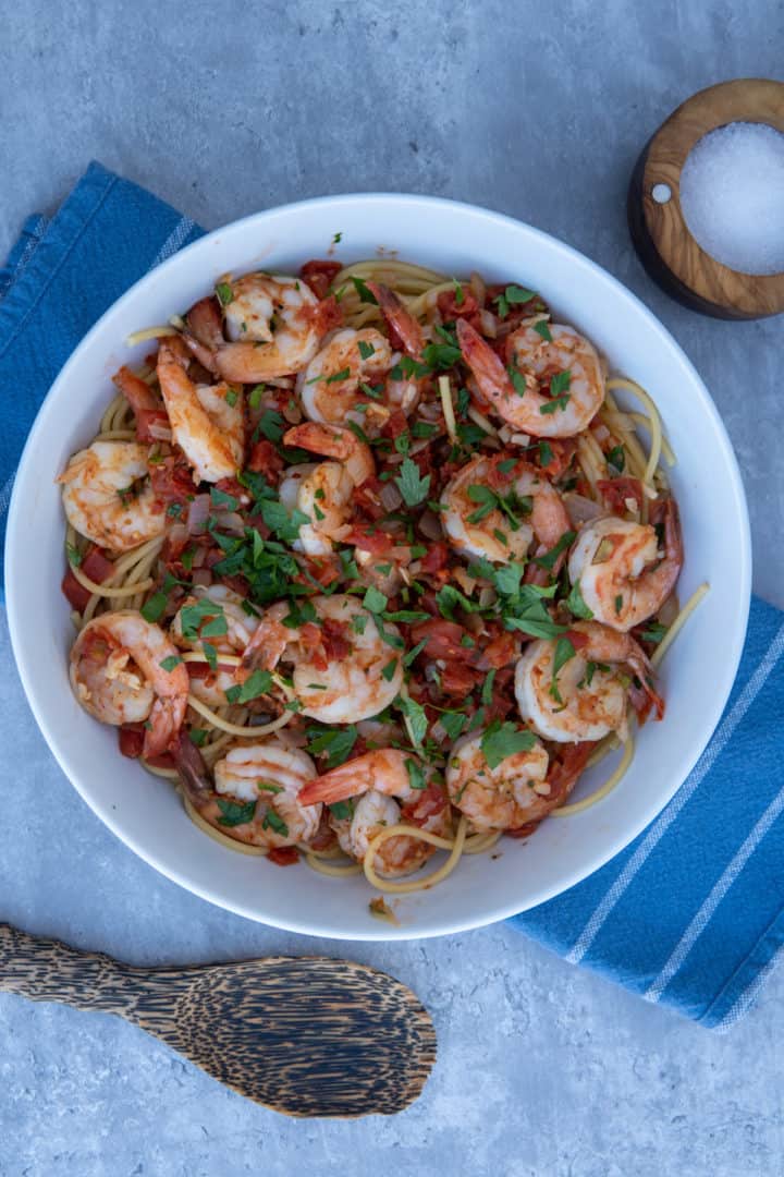 This Shrimp Fra Diavolo is made with shrimp, red pepper flakes, onion, tomatoes, white wine, garlic, parsley and served with spaghetti.