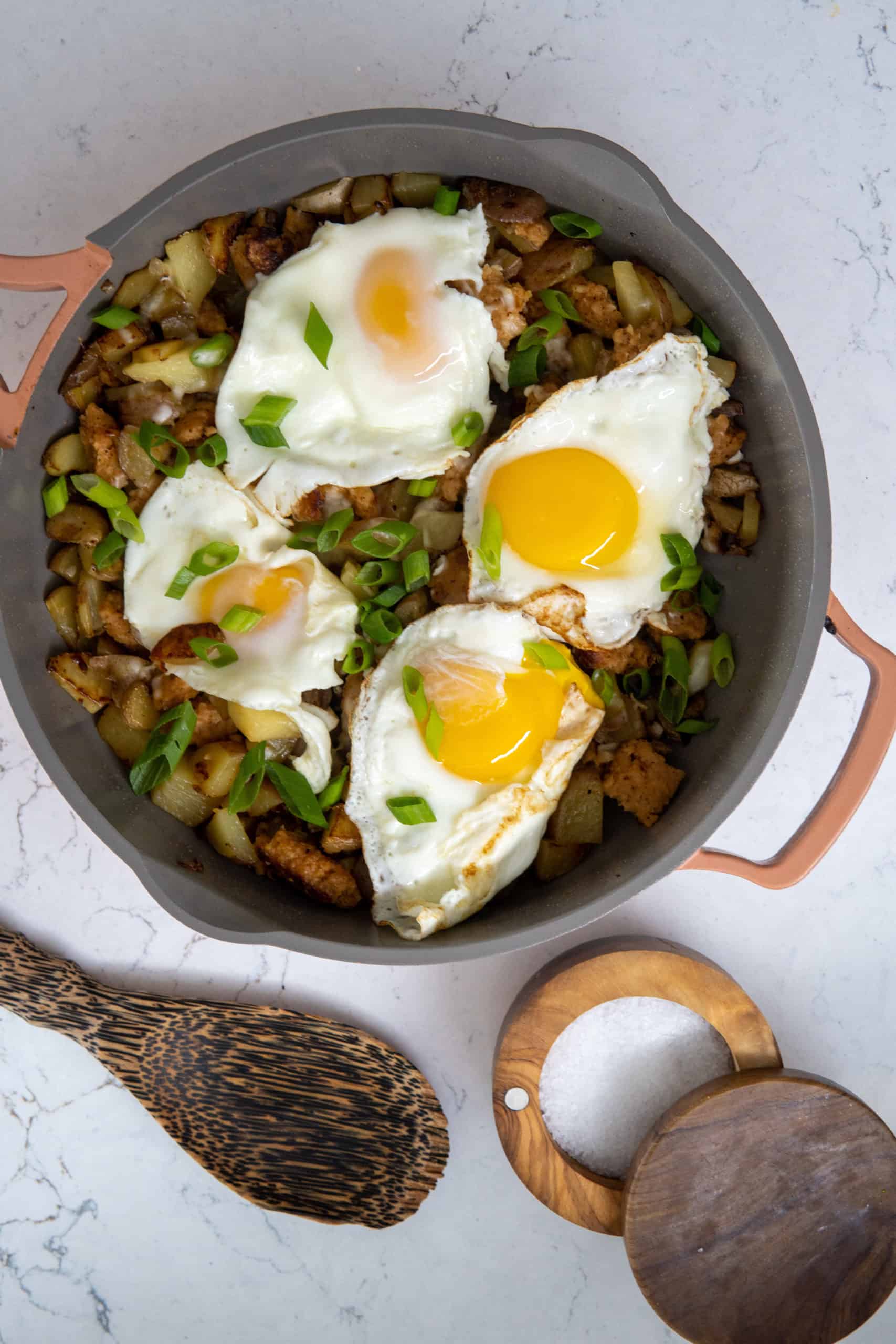 This Sausage Breakfast Casserole Recipe is made with butter, Yukon potatoes, breakfast sausage, eggs, scallions, and cooked to a nice crisp.