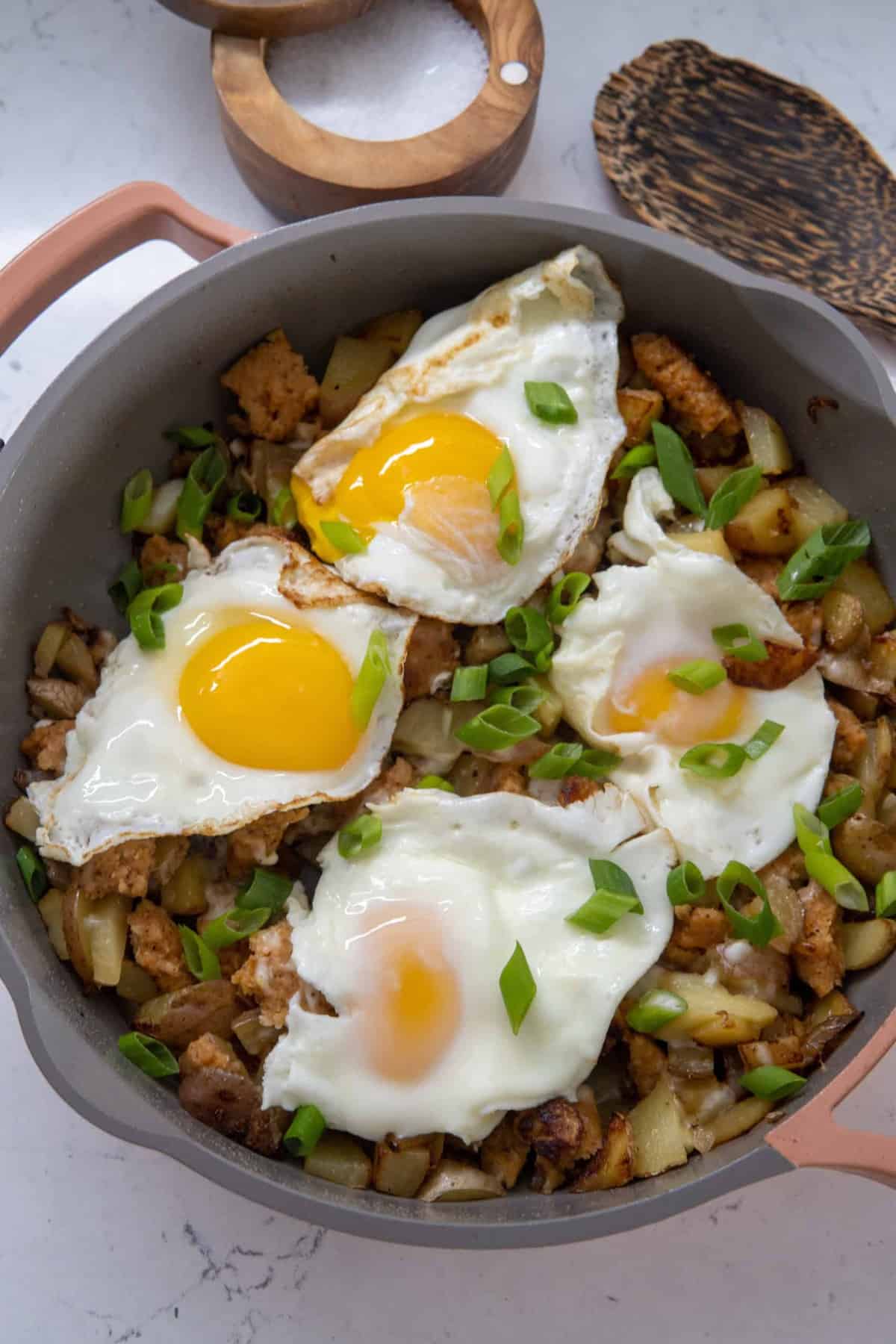 This crispy potato egg hash is made with butter oil, Yukon potatoes, breakfast sausage, eggs, scallions, and cooked to a nice crisp.