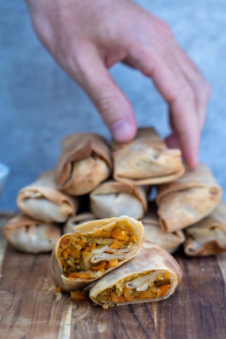 This Air Fryer Egg Rolls Recipe is made with egg roll wrappers, cabbage, carrots, garlic and ginger and air fried to perfection.