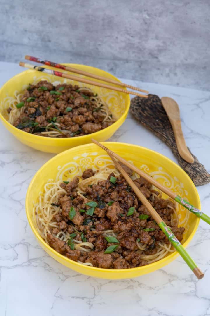 These Dan Dan Noodles are made with Chinese egg noodles, ground pork, soy sauce, hoisin sauce, rice vinegar, and Szechuan chili oil.