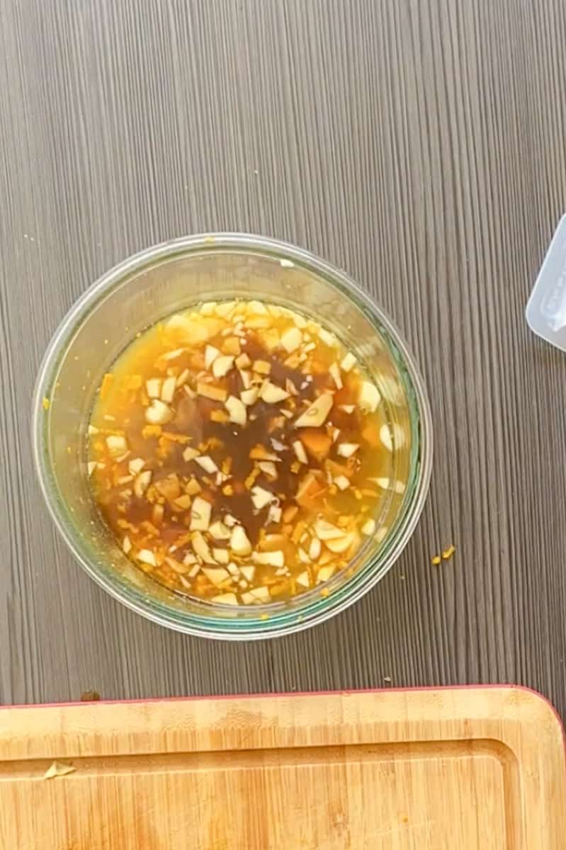 In a small bowl, whisk together the ingredients for the sauce: orange juice and zest, rice vinegar, soy sauce, ginger, garlic, honey, red pepper flakes. This is your sauce.