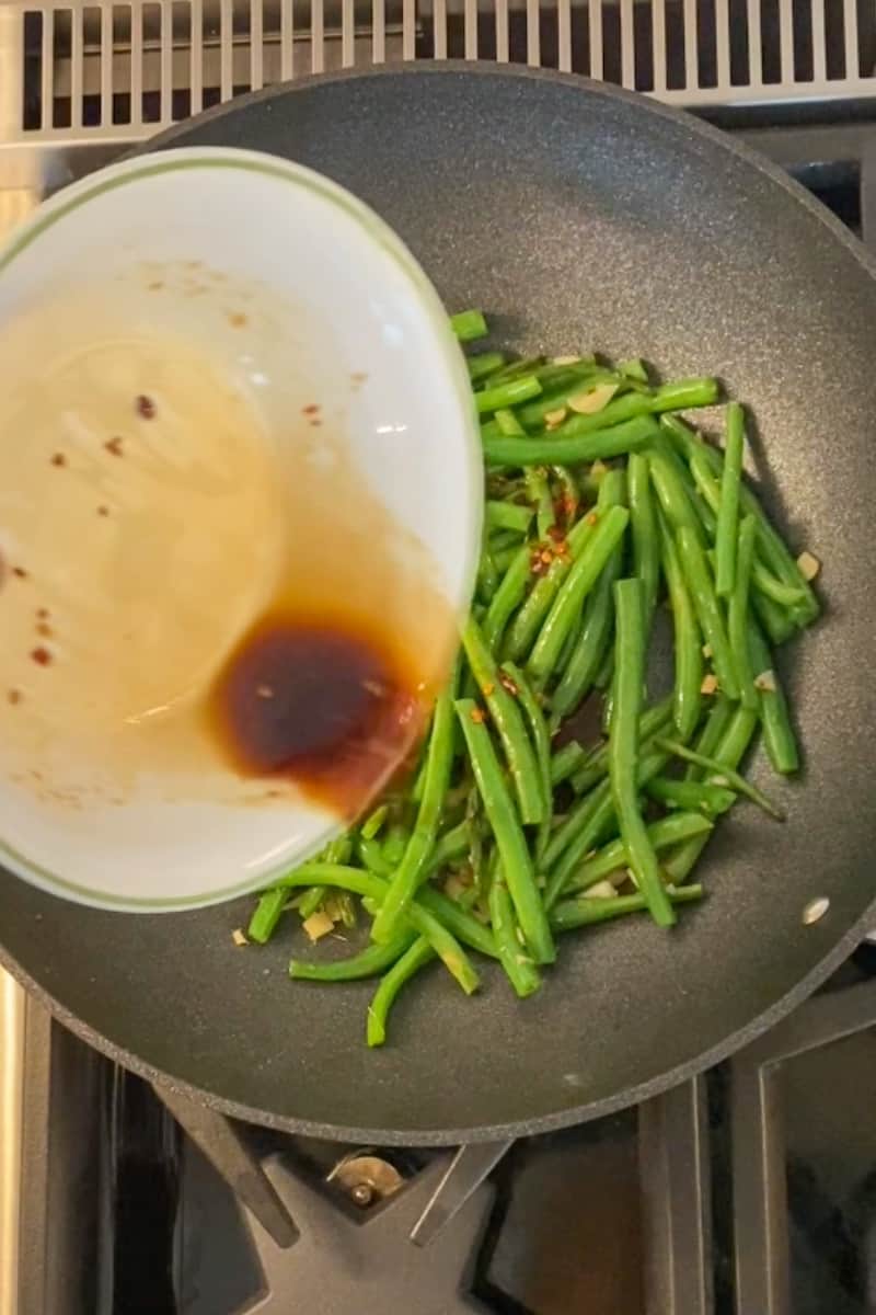 Mix the sauce together in a bowl and stir well. Pour in the sauce and cook for another 4-6 minutes until the green beans are on the softer side, but not too soft.