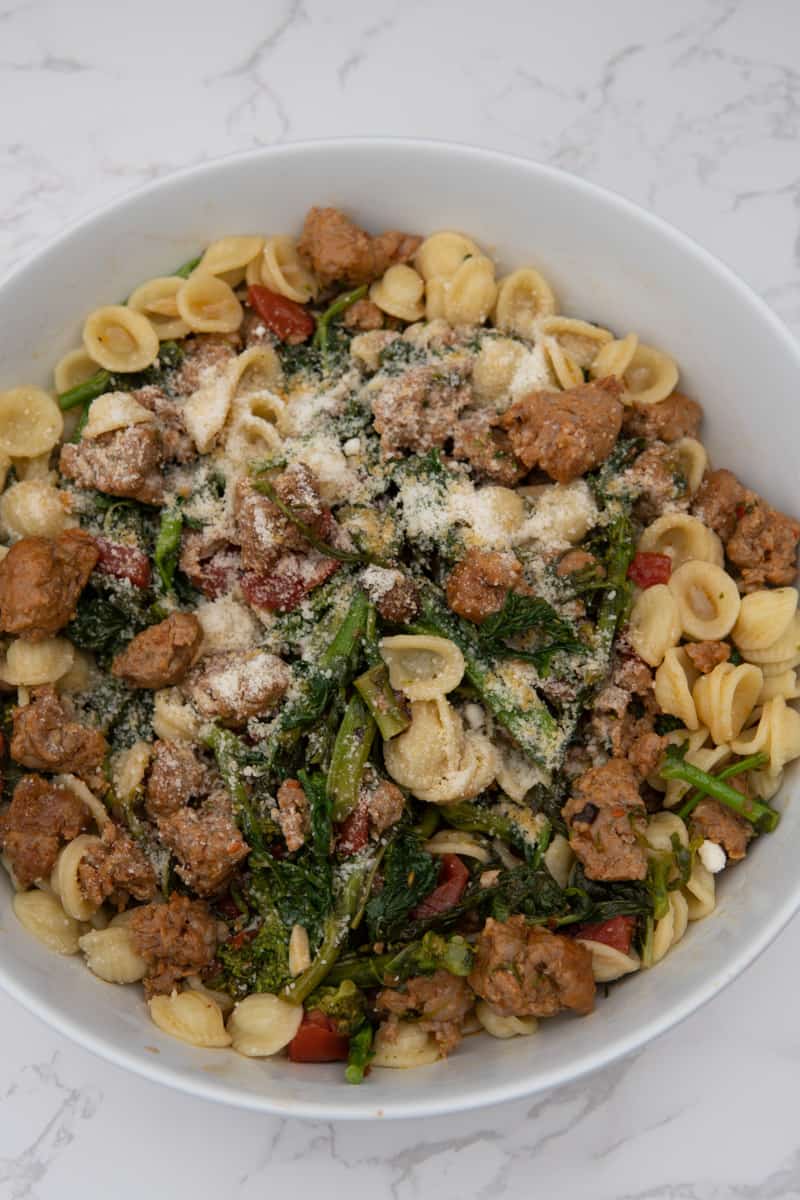 Cook the pasta in the same broccoli rabe water according to package instructions. When both the sausage mixture and pasta are done, combine and enjoy. Top with parmesan cheese and red pepper flakes to your liking. Enjoy this Orecchiette with Broccoli Rabe and Sausage.