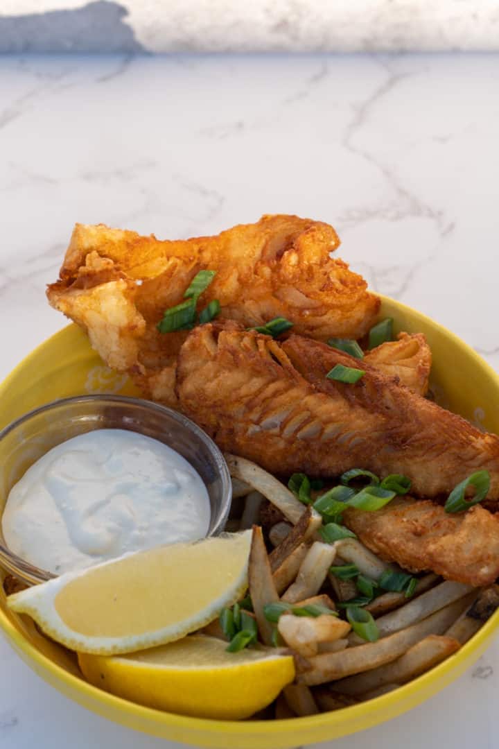 Serve with lemon wedges, tartar sauce, and/or fries. Enjoy these Beer Battered Halibut. 