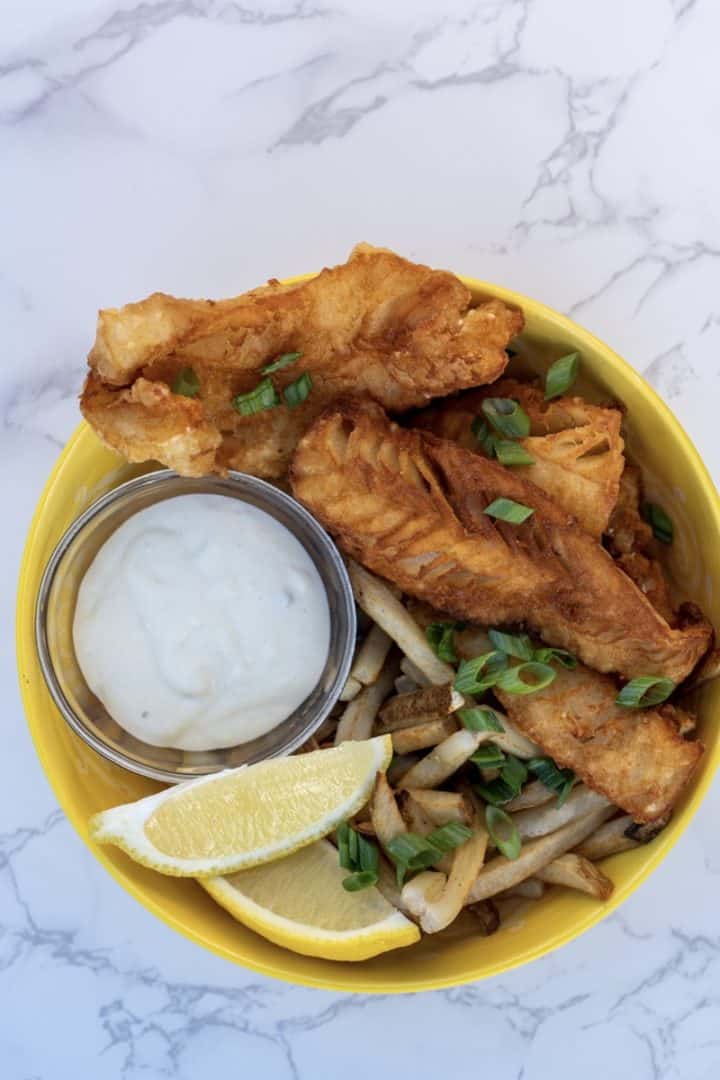 This Beer Battered Halibut is made with white fish, flour, garlic powder, chili powder, egg, beer and fried in oil.  