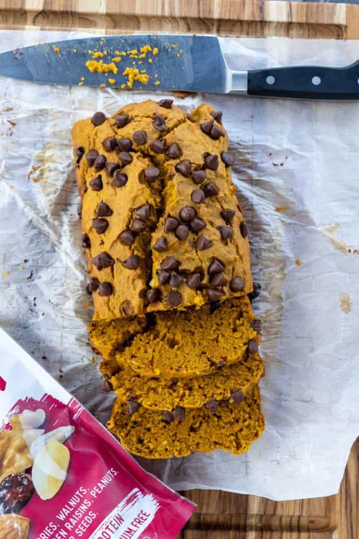 This Pumpkin Bread with Raisins and Nuts is made with flour, pumpkin puree, cinnamon, butter, sugar, nuts, milk, vanilla, chocolate chips and sweetly baked.