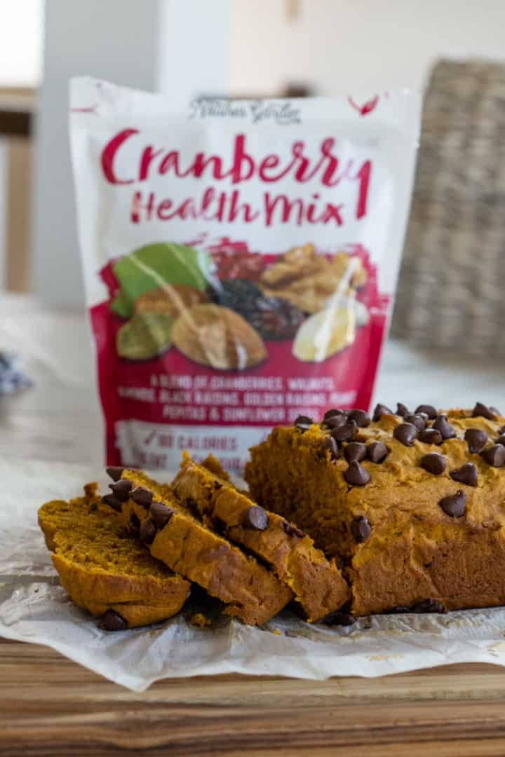 This Pumpkin Bread with Raisins and Nuts is made with flour, pumpkin puree, cinnamon, butter, sugar, nuts, milk, vanilla, chocolate chips and sweetly baked.