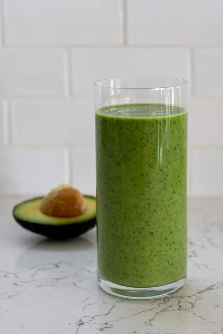 This Green Apple Smoothie is made with almond milk, apple cider vinegar, apples, bananas, kale, and blended into green perfection.