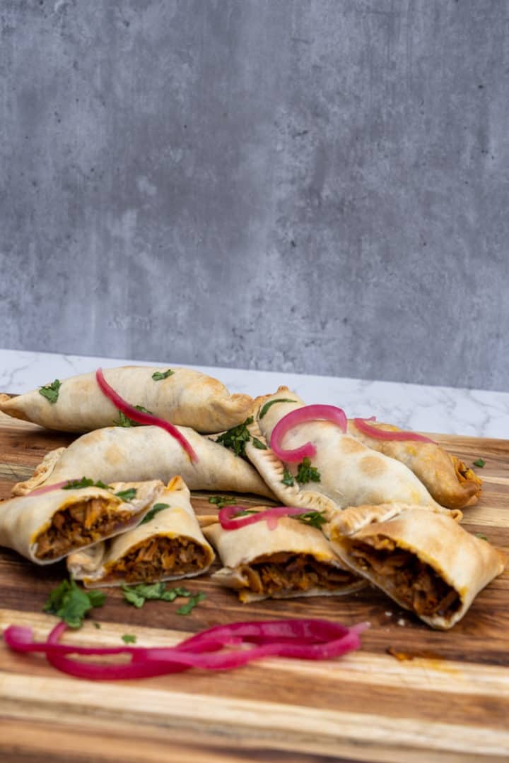 These Pulled Pork Empanadas are made with your choice of pulled pork, carnitas or cochinita pibil, empanada dough discs, and olive oil.