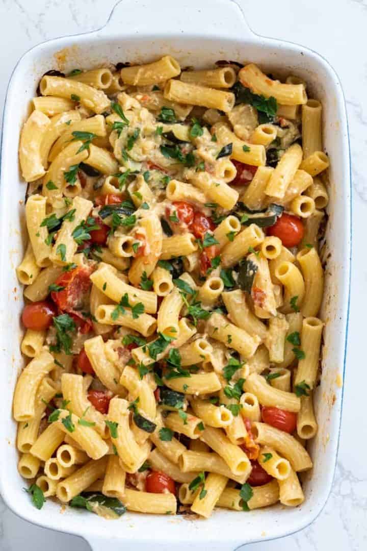 This Zucchini Pasta Bake Recipe with Cheese is made with zucchinis, cherry tomatoes, feta cheese, olive oil, oregano, and rigatoni pasta.