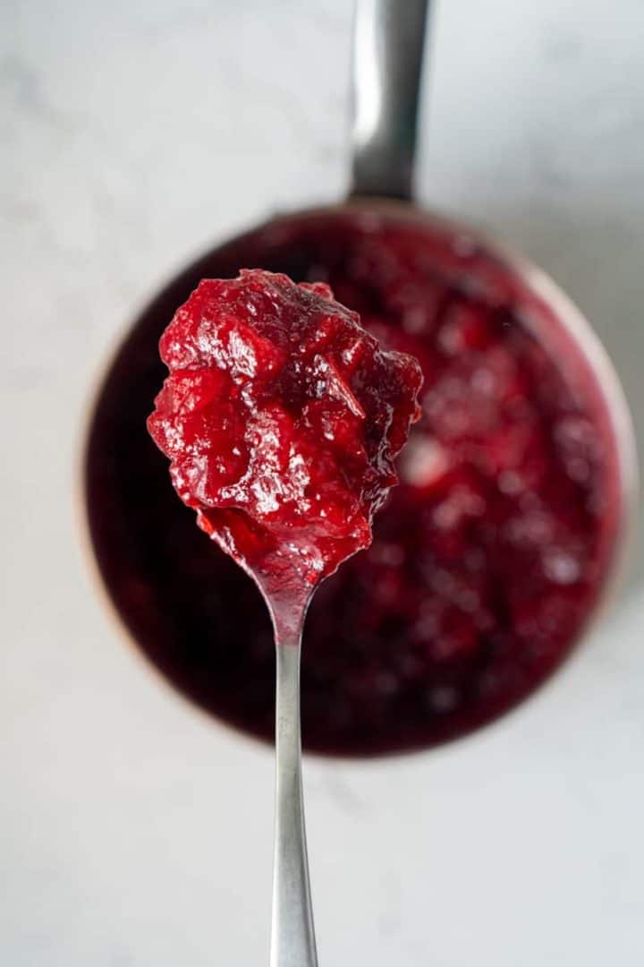 How to make Cranberry Sauce Recipe (Vegan and Gluten Free) is so easy – all you need are three ingredients and it only takes ten minutes to make.