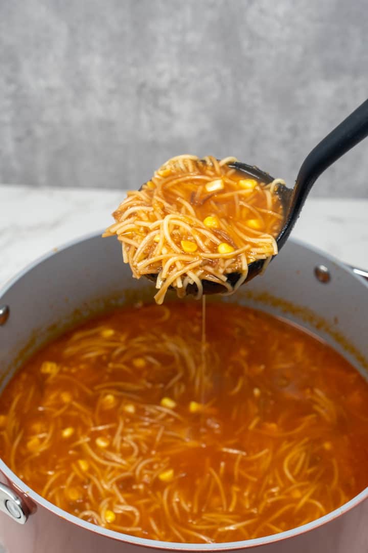 This Mexican Fideo Soup Recipe is made with fideo pasta, diced tomatoes, onion, garlic, corn, broth and simmered into perfection.