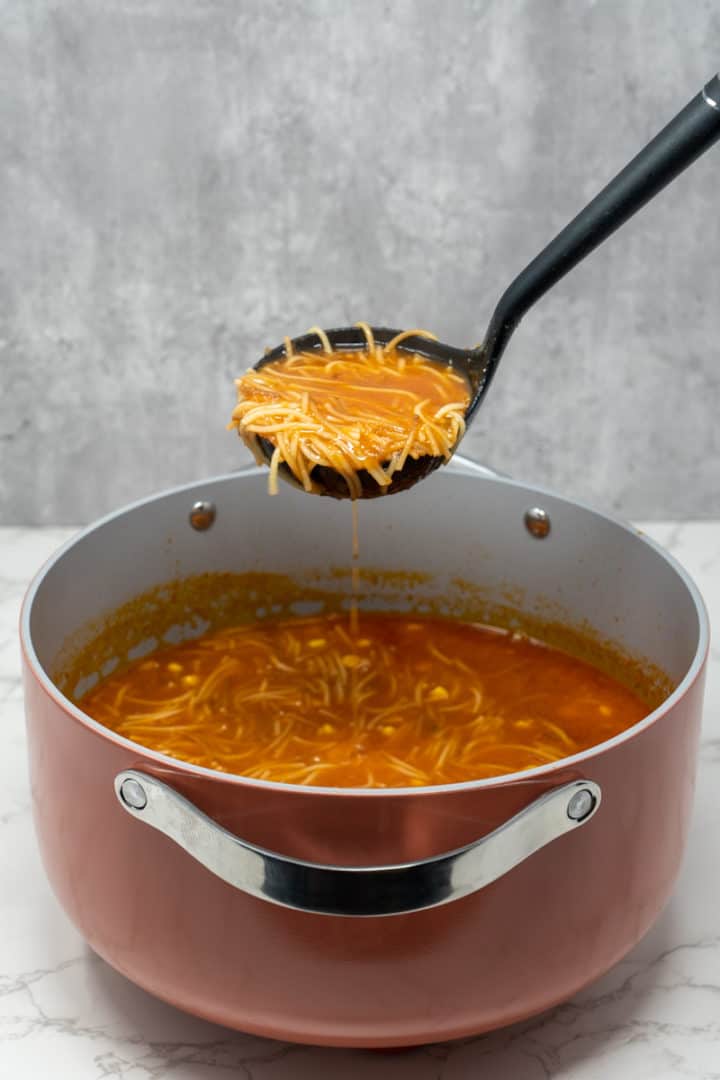 This Mexican Fideo Soup Recipe is made with fideo pasta, diced tomatoes, onion, garlic, corn, broth and simmered into perfection.