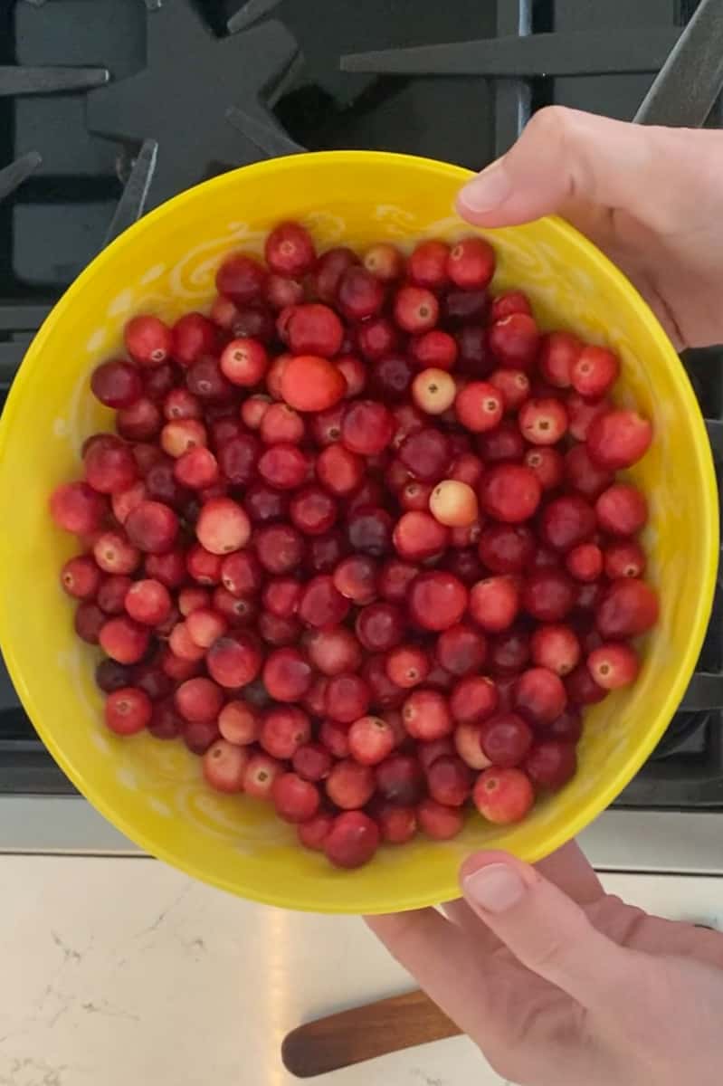 Once fully melted, add the cranberries and bring to a boil.