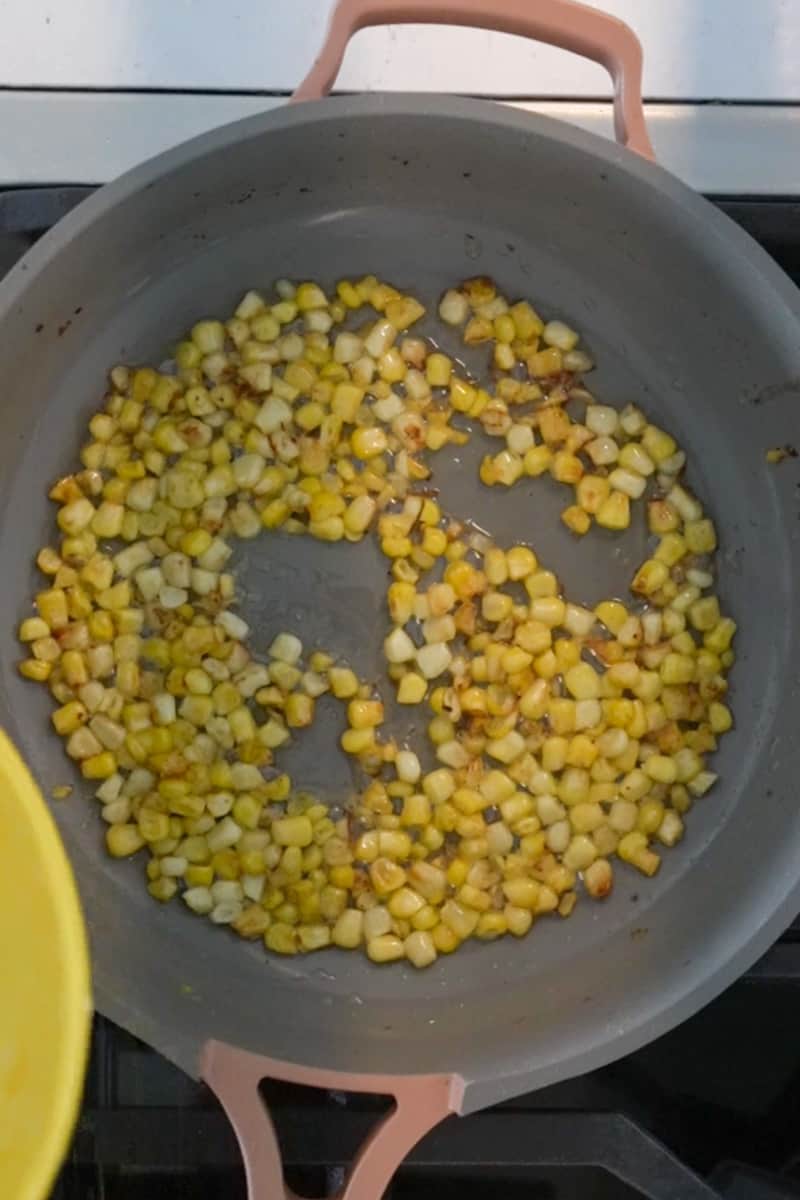 In a large saucepan on medium-high heat, add the oil and butter and wait for the butter melt and oil to shimmer. Toss in the corn and cook for 5-6 minutes, tossing frequently. The corn will pop like popcorn, that just means its working! Once the corn is golden brown, place on a plate to the side.